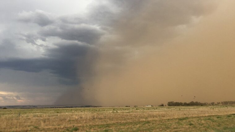 A dust storm rolls over the plains of the Free State, close to the Vaal Dam in South Africa